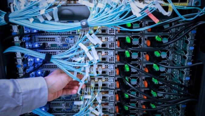 A server being serviced by an IT provider with cat6 networking cables visible