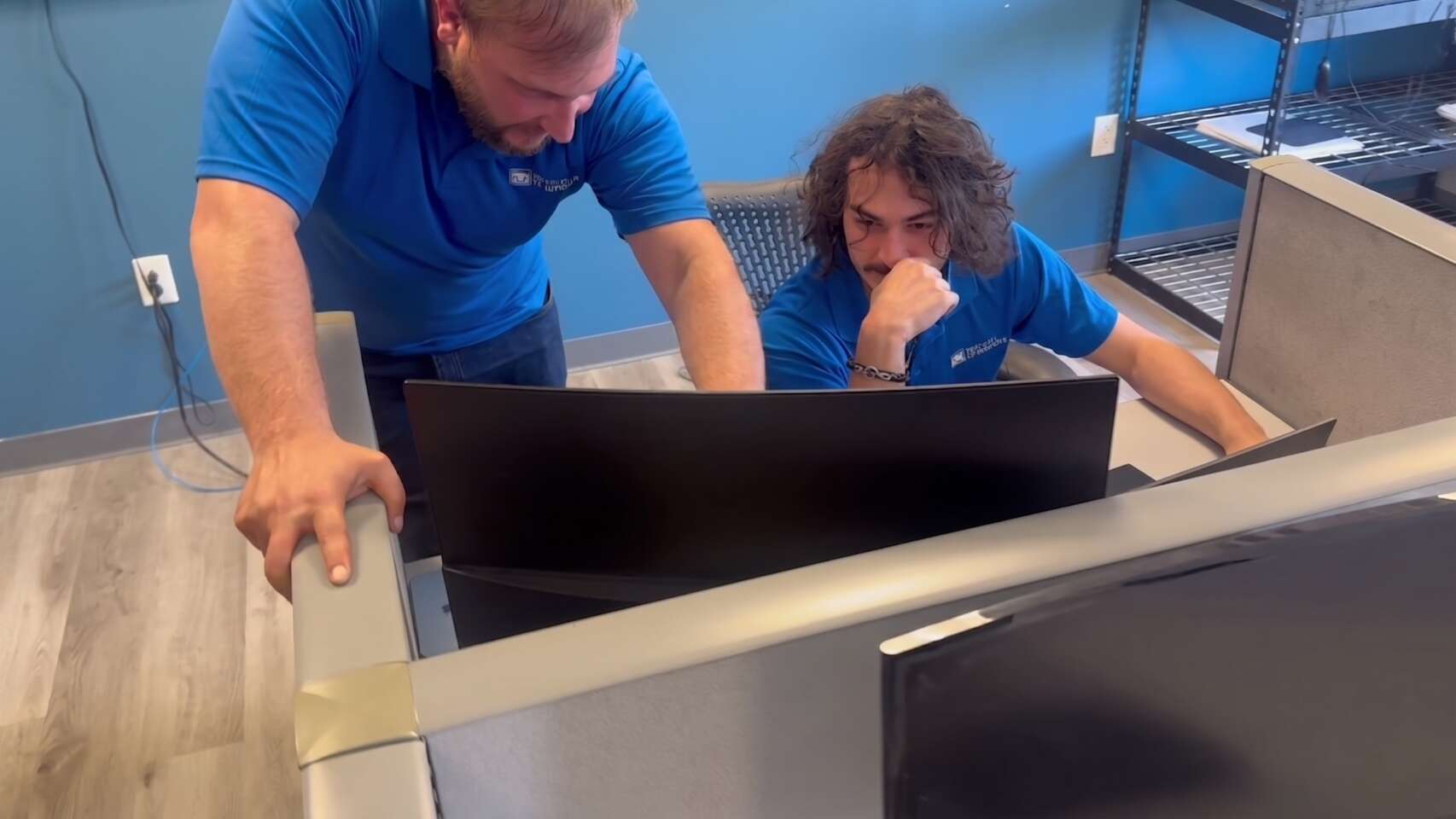 Two Buffalo IT Services technicians working through a client issue together